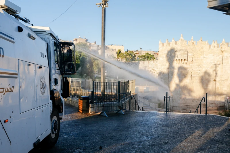 File:Israeli security forces spraying Palestinians at Damascus Gate with Skunk.jpeg